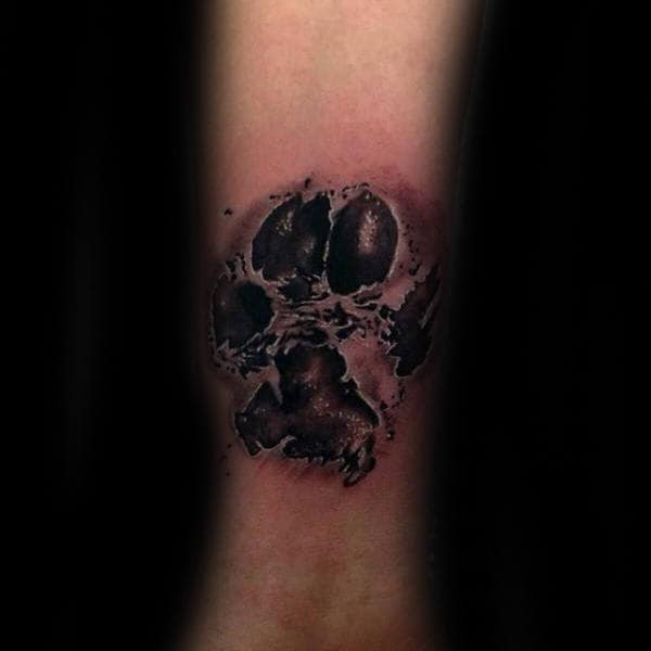 Hand and paw tattoo located on the inner forearm.
