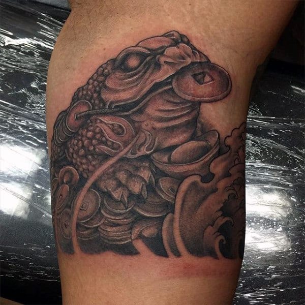 Male Arms Black And Grey Frog With Coin Tattoo