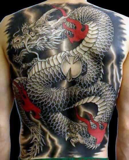 Male Black And Red Ink Tattoo Of Chinese Dragon On Back