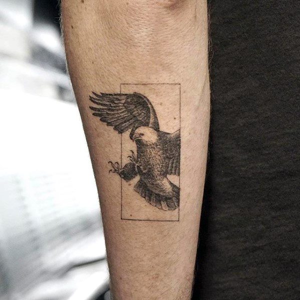 Male Outer Forearm Tattoo With Quarter Sized Flying Bald Eagle Design