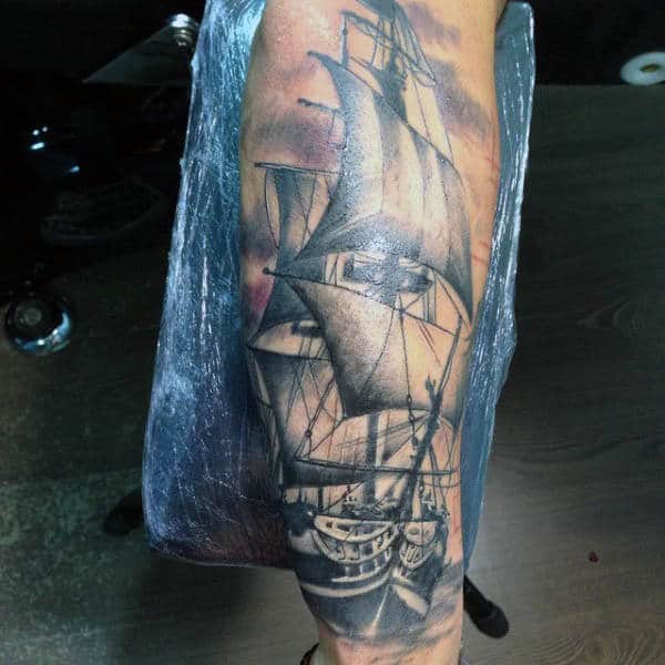 Male Tattoo Of Boat With Sails