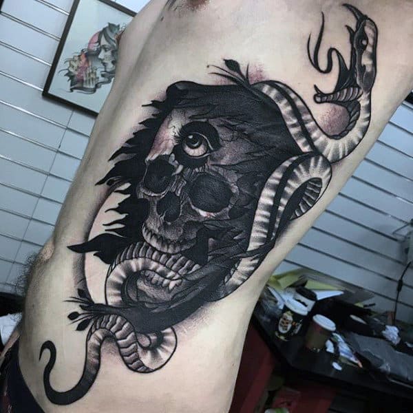 Male Torso Interesting Evil One Eyed Skull And Snake Tattoo