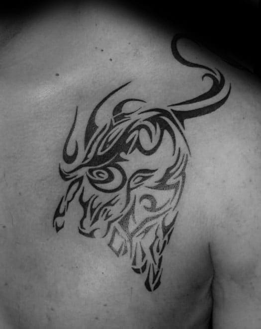 Male Upper Chest Tribal Bull Tattoo Inspiration