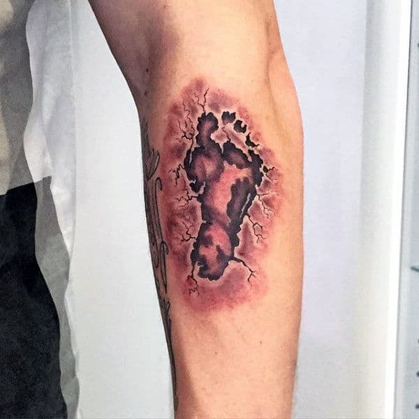 Male With 3d Stone Footprint Arm Tattoo Ideas