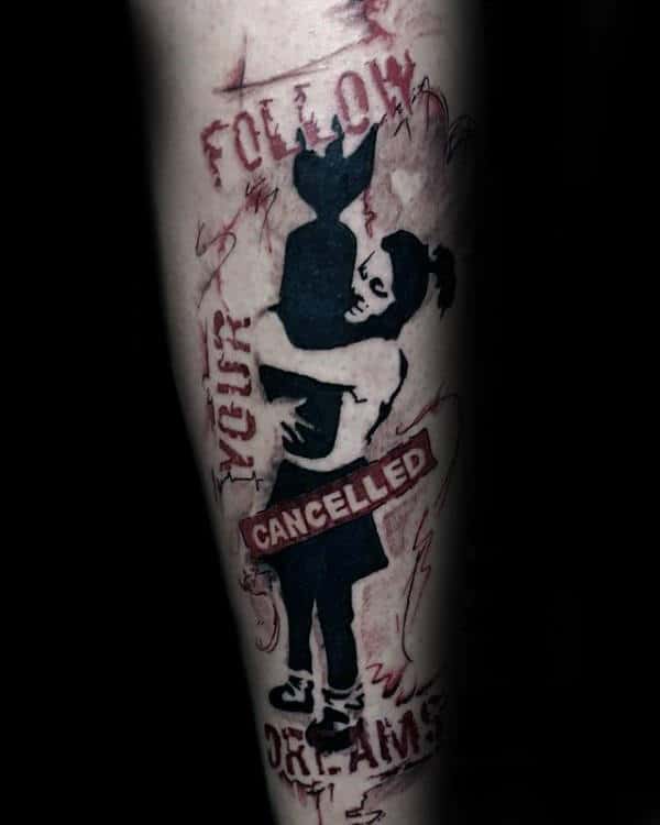 Male With Banksy Art Forearm Tattoo