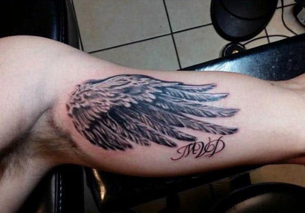 Male With Bicep Tattoo Wings