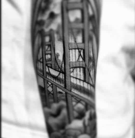 Male With Black And Grey Shaded Golden Gate Bridge Sleeve Tattoo