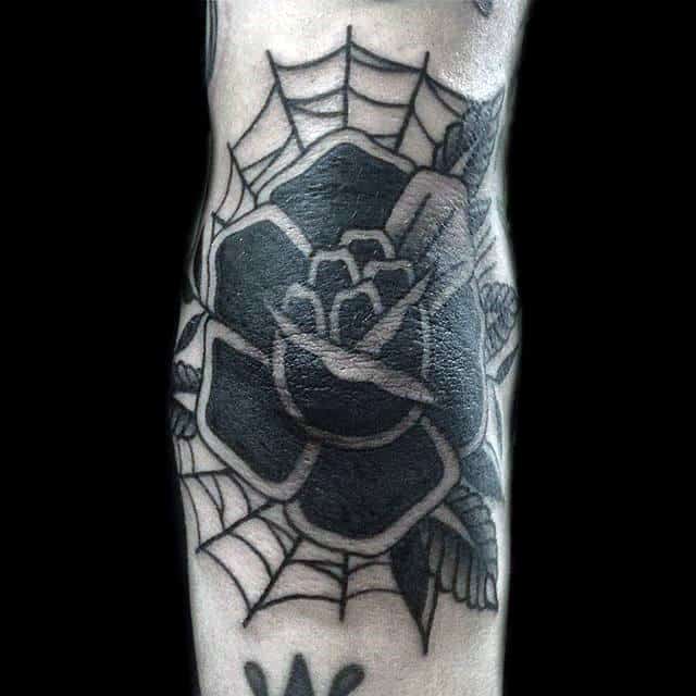 Male With Black Rose Elbow Tattoo