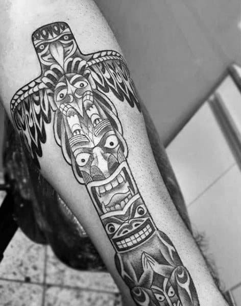 Male With Black Work Manly Totem Pole Forearm Tattoo
