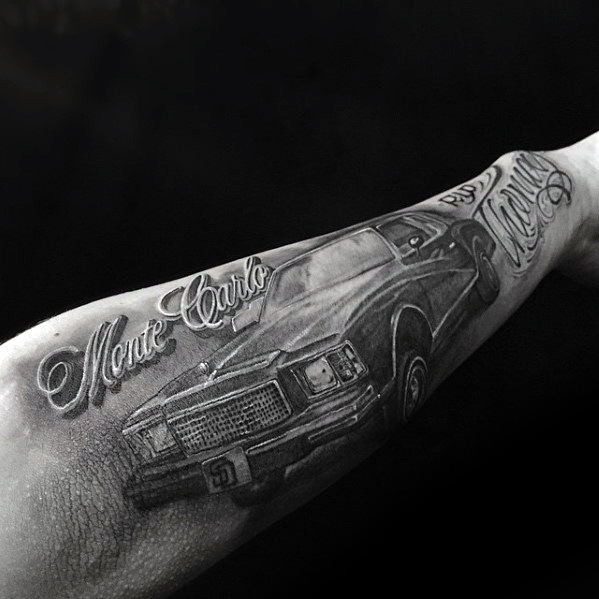 Male With Chevy Monte Carlo Outer Forearm Tattoo