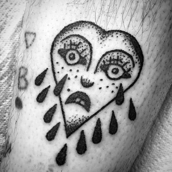 Male With Cool Crying Heart Tattoo Design On Leg