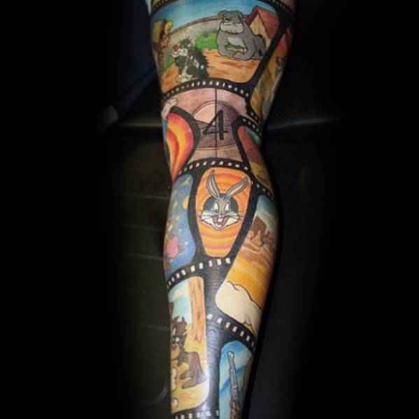 Male With Cool Looney Tunes Tattoo Design Full Leg Sleeve