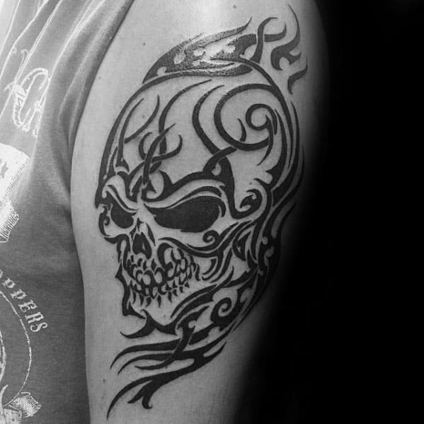 Male With Cool Outer Arm Tribal Skull Tattoo Design