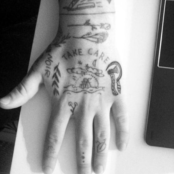 Male With Cool Simple Hand Tattoo Design