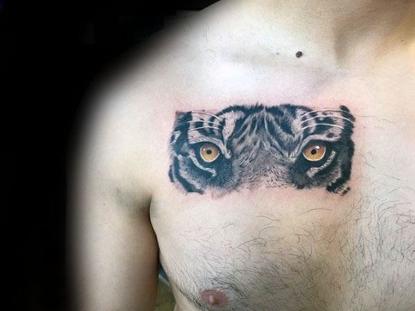 Male With Cool Tiger Eyes Tattoo Design On Chest