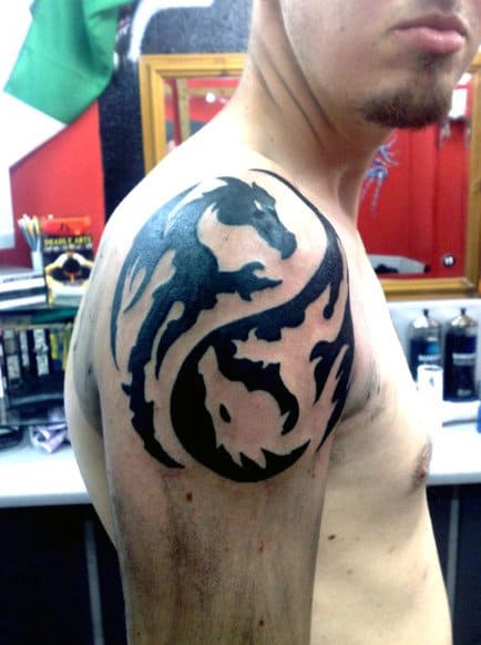 Male With Dragon Yin Yang Tattoo On Arm And Shoulder