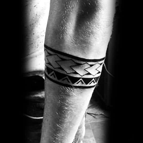 Male With Forearm Band Tattoo With Polynesian Tribal Design