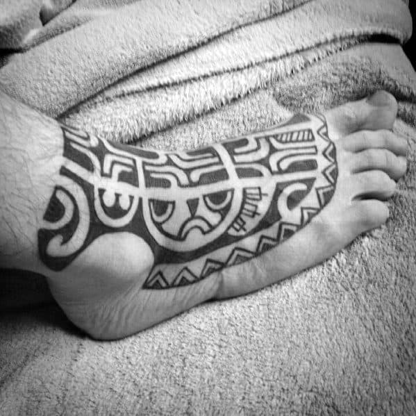 Male With Hawaiian Foot Tribal Tattoo Design