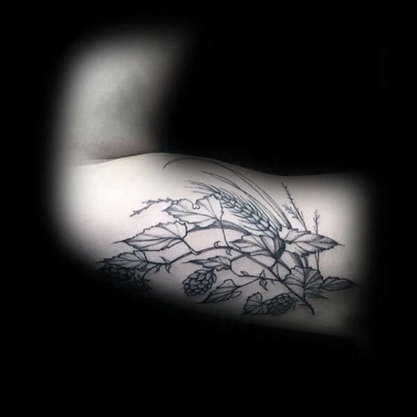 Male With Inner Arm Bicep Tattoo Of Wheat And Leaves