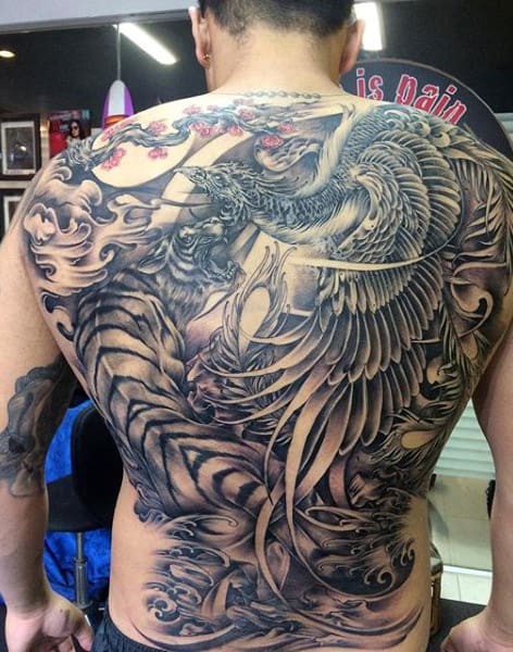 Male With Lovely Large Feathered Pair Of Dragons Tattoo On Full Back
