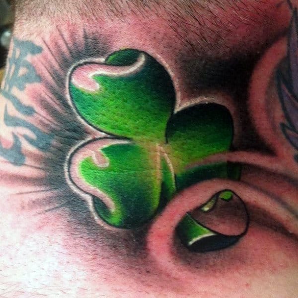 Male With Neck Tattoo Of Green Shamrock