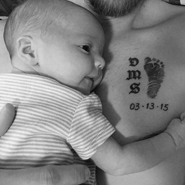 Male With New Born Baby Footprint Chest Tattoo