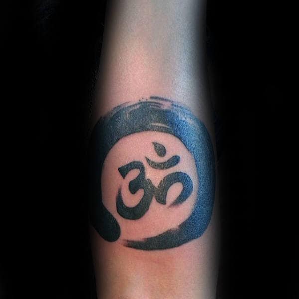 Male With Om Circle Brush Stroke Tattoo On Innerforearm