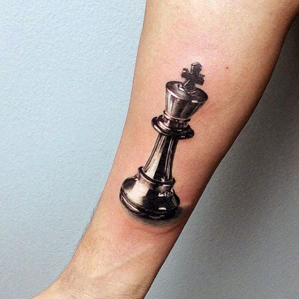 Male With Realistic 3d King Chess Piece Inner Forearm Tattoo Design