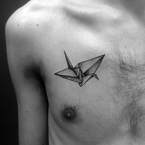 Male With Small Origami Paper Bird Dotwok Upper Chest Tattoo
