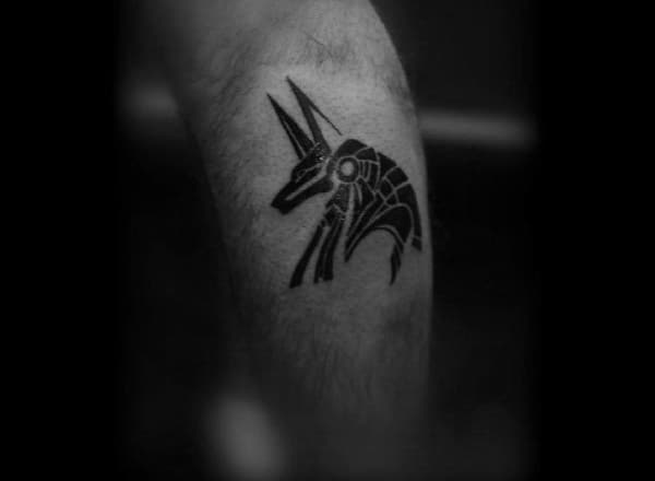 Male With Small Simple Anubis Leg Tattoo