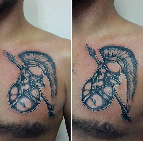 Male With Spear Upper Chest Tattoo