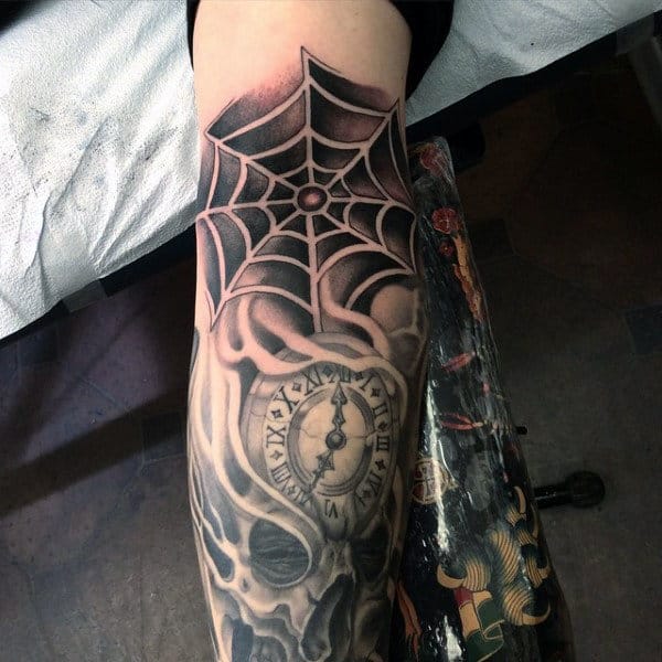 Male With Spider Web Inner Elbow Tattoo Negative Space Design