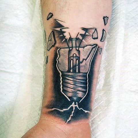 Male With Tattoo Of Shattered Light Bulb Glass On Wrist