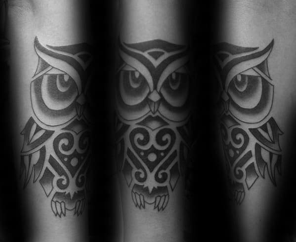 Male With Unique Tribal Owl Outer Forearm Tattoo