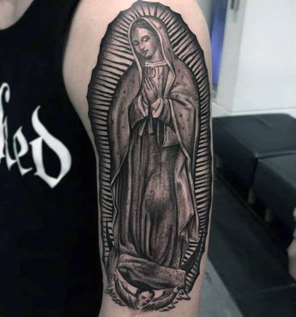 Male With Virgin Mary Upper Arm Tattoo