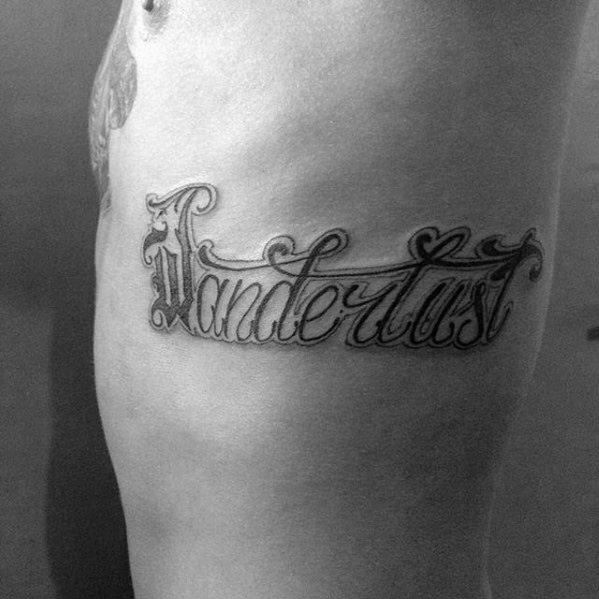 Male With Wanderlust Script Rib Cage Side Tattoo