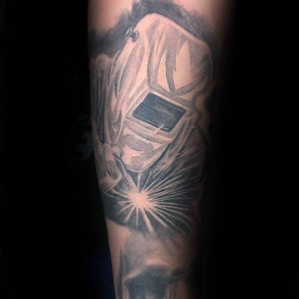 Male With Welding Shaded Black And Grey Tattoo On Forearms
