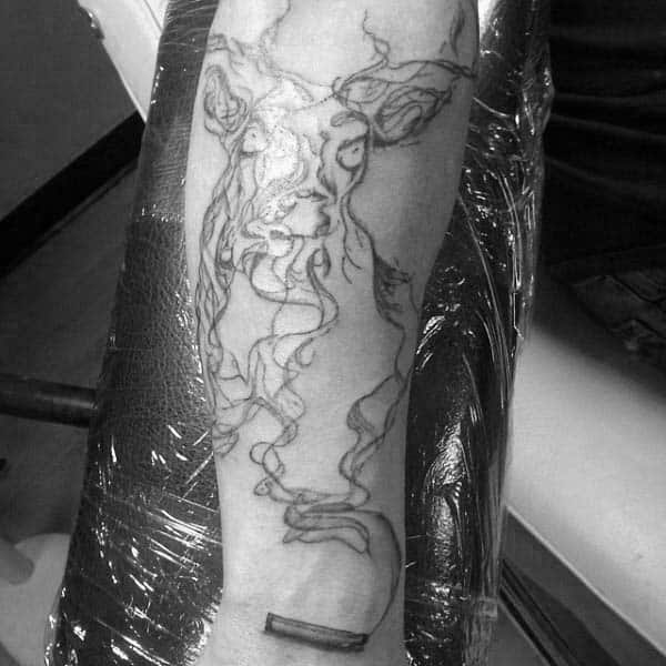Male With Wrist Tattoo Of Spent Bullet Casing Shell And Deer In Smoke