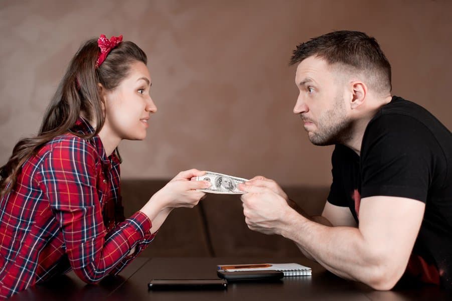 man trying to take money from the woman