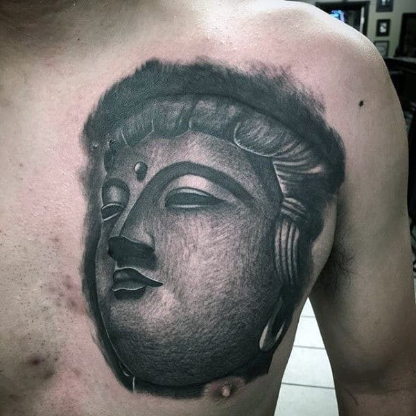 Man With Buddha Face Tattoo On Chest