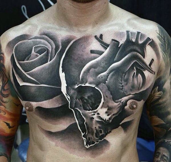 Man With Abstract Rose And Heart Tattoo On Chest