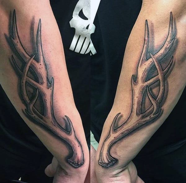 Man With Antlers On Outer Forearms Tattoos
