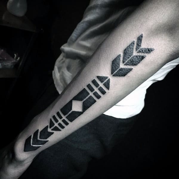 Man With Arrow Shapes Blackwork Tattoo On Outer Forearm