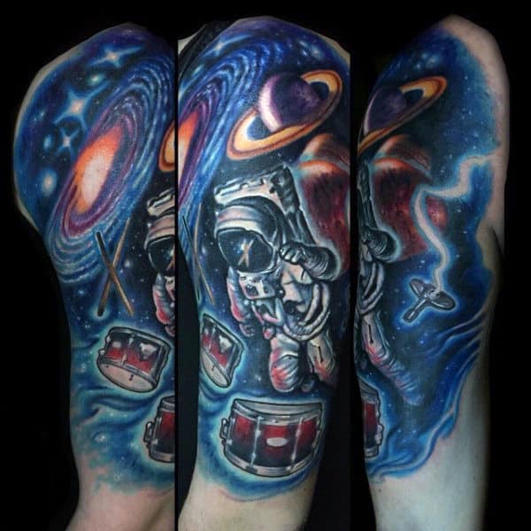 Man With Astronaut Beating Drums Tattoo