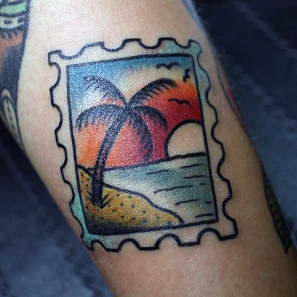 Man With Beach With Ocean Wave Tattoo Of Postage Stamp