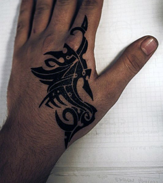 Man With Black Ink Tribal Hand Tattoo