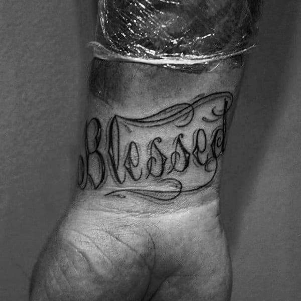 Man With Blessed Wrist Tattoo