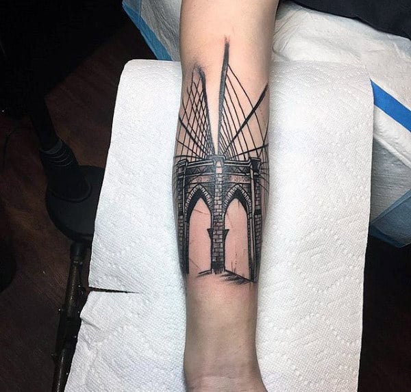 Man With Brooklyn Bridge Forearm Tattoo