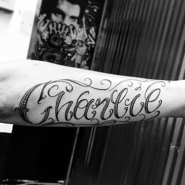 Man With Charlie Name Outer Forearm Tattoo
