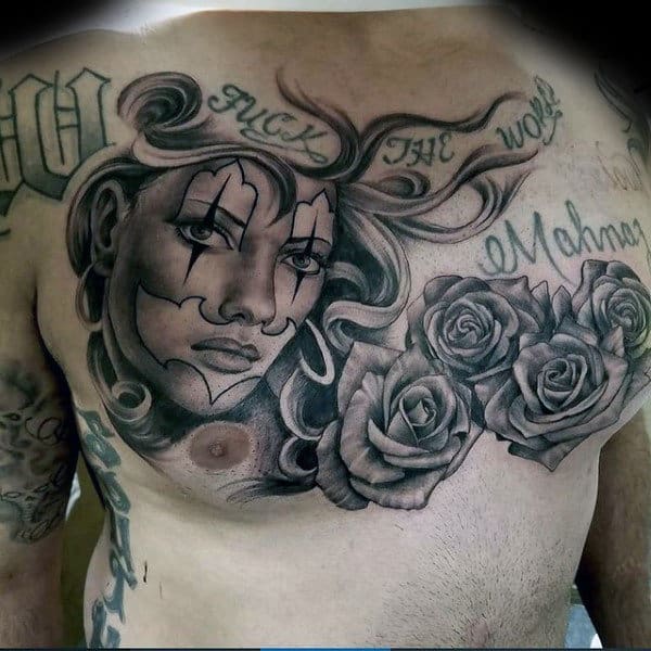 Man With Chicano Tattoo Of Female And Roses On Upper Chest